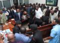Vetting chaos forces venue change as tables, microphones are destroyed