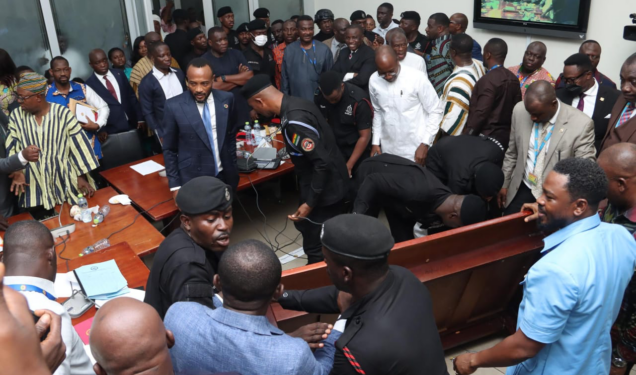 Vetting chaos forces venue change as tables, microphones are destroyed