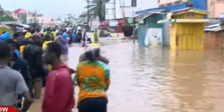 Floods paralyze Accra after torrential rains, leaving one electrocuted.