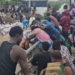 Residents Turn Flooded Gutters into ‘Shopping Aisles’ After Warehouse Cargo Is Swept Away by Rains